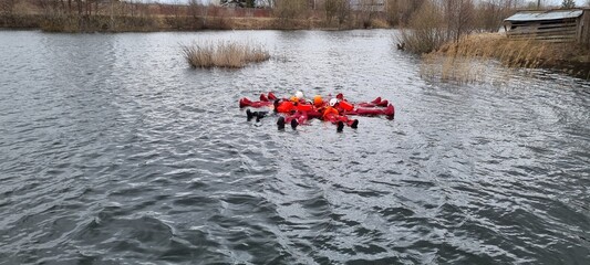 Delegates do practical exercises during a training session on Sea Survival