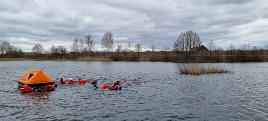 Delegates do practical exercises during a training session on Sea Survival