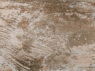 A plastered concrete surface with rough brush strokes. Paint brushed wall background with detailed texture.