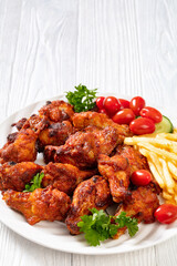 roast chicken wings with french fries and veggies