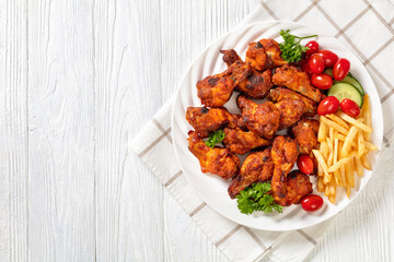 roast chicken wings with french fries and veggies