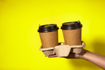Promotion two for the price of one, coffee delivery on a yellow background