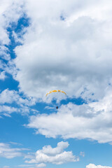 A paraglider on the background of a beautiful blue sky. Top view of the embers in the Beskid Mały. A popular place in Silesia. Bielsko Biała, Poland