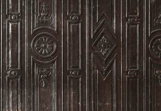 Dark bog oak wall panel with decorative carving