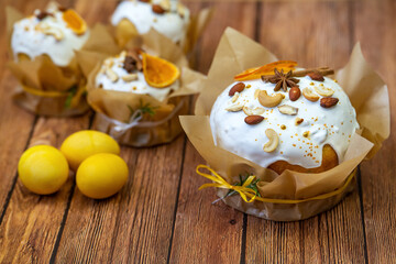Delicious Easter cakes and eggs. Russian Easter bread (Kulich) on a wooden table. 