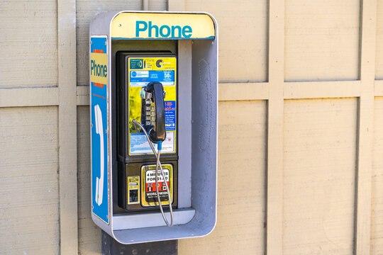 Public payphone for emergency call on street.
