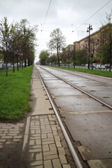 Fototapeta premium tram tracks on the avenue in the city in spring