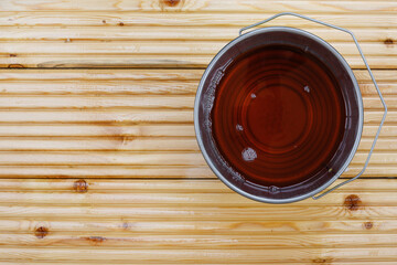 Special waterproof protective oil on larch floor as pattern or background. Copy space. View from above.
