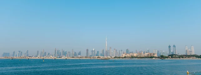 Zelfklevend Fotobehang Dubai's downtown city landscape view with the sea in the front © Sravan Chandran
