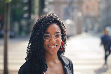 portrait of a  smiling woman in the street
