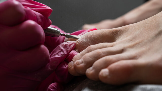 The master makes hardware pedicures to the client. 