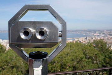 Viewpoint on a hill in Marseille, France, with mounted binoculars in the center