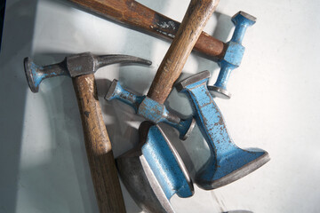 Hammer for repair and construction works on white surface