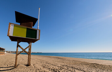Lifeguard chair on a beach of the Mediterranean Sea, on the Costa del Sol - obrazy, fototapety, plakaty