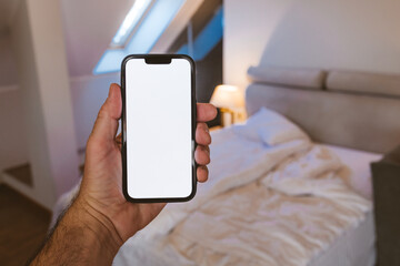 Smartphone mockup screen, man using mobile phone in bedroom