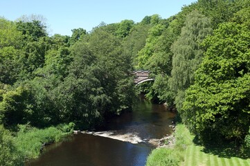 Fototapeta na wymiar River Doon in the village of Alloway near Ayr as it flows to the sea.