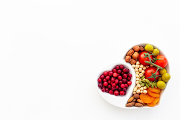 Healthy lifestyle and nutrition eating concept with food in heart shaped dish