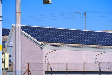 Roof of industrial building with solar panels at City of Zürich on a sunny spring day. Photo taken April 28th, 2022, Zurich, Switzerland.