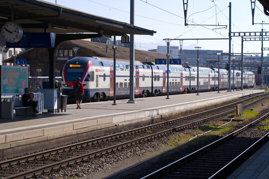 Railway station of City of Rapperswil with SBB train arriving on a sunny spring day. Photo taken April 28th, 2022, Rapperswil-Jona, Switzerland.