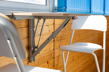 folding wall table in the unfolded position on the balcony