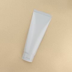 Sunscreen cream mockup. Blank packaging of cosmetics on the sand. 3d illustration.