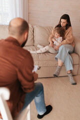 Woman and daughter at psychologist