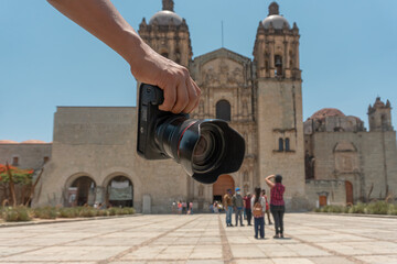 a Photographer holding camera in the oaxaca city mexico