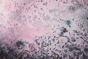 Ink abstract background, paint bubbles pattern underwater, light pink acrylic pigment