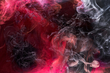 Fototapeta na wymiar Black and red ink background, colorful fog, abstract swirling ocean, acrylic paint pigment underwater, white smoke