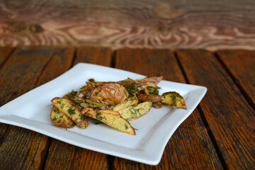 Appetizing fried potatoes with dill