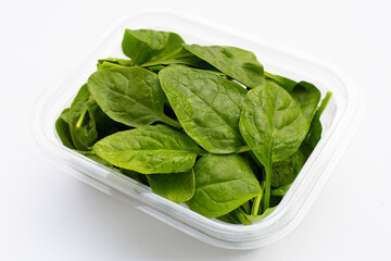 Spinach leaves on white background.