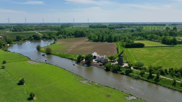 The Dutch town of Beesd from the air with its characteristic stubby tower and windmill De Vrijheid