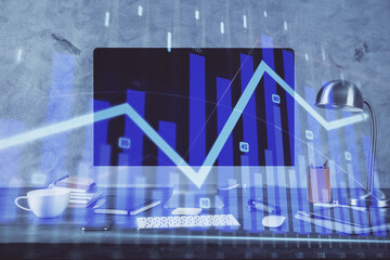 Forex market graph hologram and personal computer on background. Multi exposure. Concept of investment.