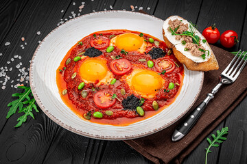 Shakshuka eggs with black caviar