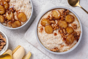 Porridge with caramelised banana and walnut for healthy breakfast