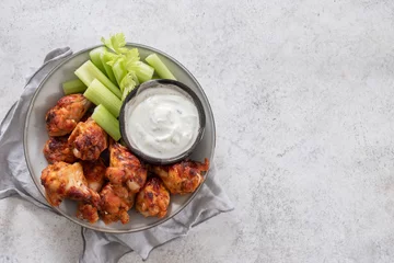Outdoor kussens buffalo chicken wings with celery and ranch sauce © azurita