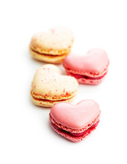 Heart shaped Sweet macarons isolated on white background.