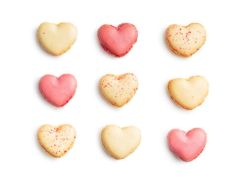 Heart shaped Sweet macarons isolated on white background.
