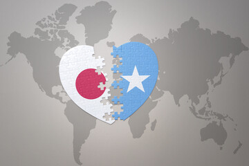 puzzle heart with the national flag of japan and somalia on a world map background. Concept. 3D illustration