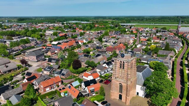 The Dutch town of Beesd from the air with its characteristic stubby tower and windmill De Vrijheid