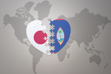 puzzle heart with the national flag of japan and guam on a world map background. Concept. 3D illustration
