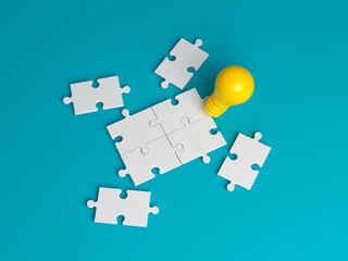 Light bulb icon and jigsaw puzzle pieces global finance concept. On green color background. Horizontal composition. Isolated with clipping path.
