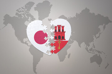 puzzle heart with the national flag of japan and gibraltar on a world map background. Concept. 3D illustration