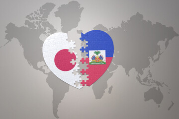 puzzle heart with the national flag of japan and haiti on a world map background. Concept. 3D...