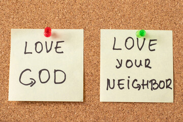 Love God, love your neighbor, handwritten notes on a pinning board. The biblical concept of...