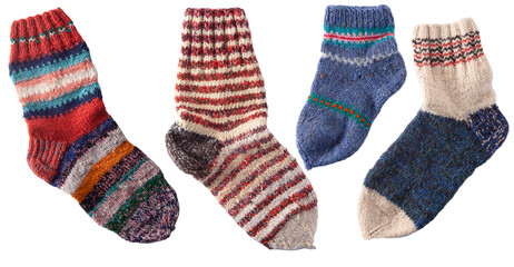 Set of different knitting socks from woolen threads. Handmade cozy homemade warm winter colorful...