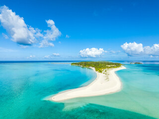 Fototapeta premium Maldives paradise scenery. Tropical aerial landscape, seascape with long jetty, water villas with amazing sea and lagoon beach, tropical nature. Exotic tourism destination banner, summer vacation