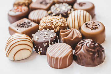 Assortment of dark, white and milk chocolate isolated on white background