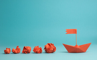 New ideas or transformation concept with crumpled paper balls and a boat, transformation or teamwork concept, creativity, make a change - obrazy, fototapety, plakaty