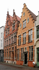 Fototapeta na wymiar ancient houses with gabled facades in the medieval part of the town Bruges, Belgium